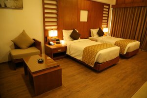 Karthika Park in Thiruvananthapuram (Trivandrum), image may contain: Hotel, Bed, Furniture, Resort