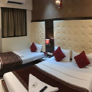 Hotel A. K. International in Mumbai, image may contain: Hotel, Resort, Bed, Cushion