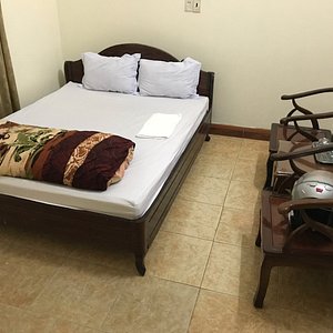 The bed with two chairs and a table