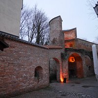 Old city wall with the gate that leads to the Sempt river.