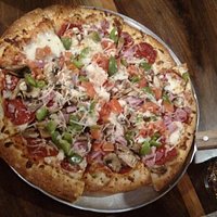 Coreys Special, Pepperoni, bell peppers, onions, tomatoes, sausage and mushrooms.
