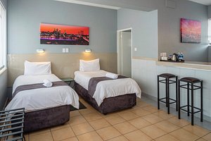 N1 Hotel Bulawayo in Bulawayo, image may contain: Furniture, Bed, Monitor, Screen