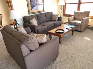 Bridgeport Waterfront Resort in Sturgeon Bay, image may contain: Couch, Furniture, Table, Chair