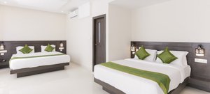 Treebo Trend Sunrise in Chikmagalur, image may contain: Interior Design, Cushion, Home Decor, Furniture