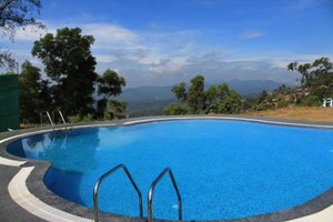 Hotel Mayura Valley View Madikeri in Madikeri, image may contain: Hotel, Resort, Pool, Water