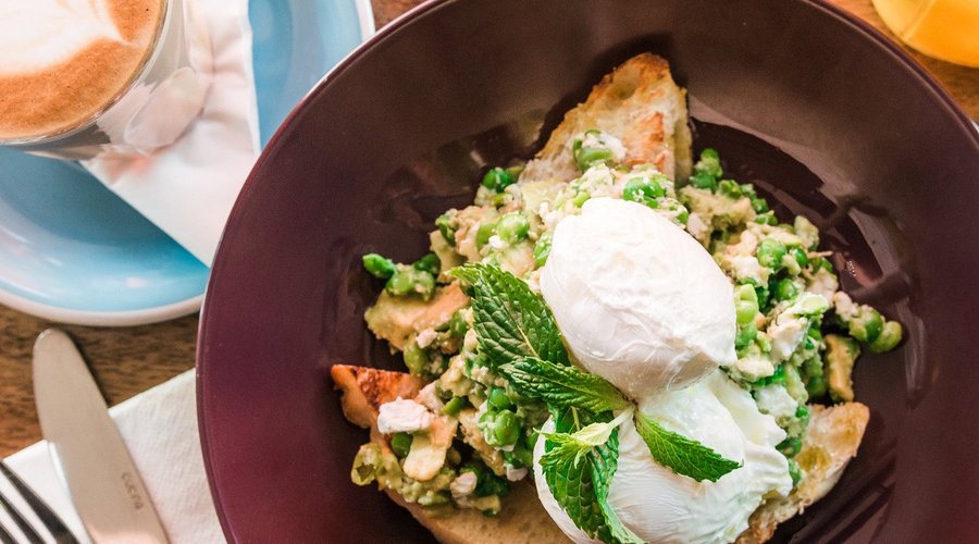 Pea and Avo Smash, with fetta cheese and soft poached eggs on toasted ciabatta