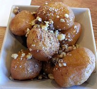 fried dough balls with honey, cinnamon & crushed wallnuts