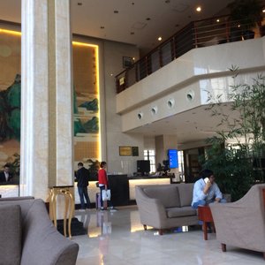 Huashan International Hotel in Xi'an, image may contain: Interior Design, Bed, Furniture, Bedroom