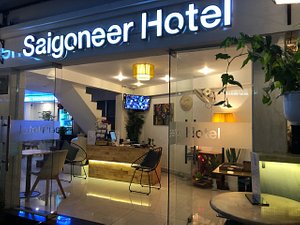 Saigoneer Hostel in Ho Chi Minh City, image may contain: Restaurant, Lighting, Cafe, Cafeteria