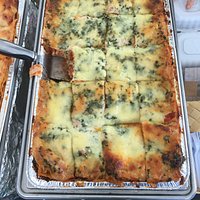 Hot vegetable lasagna, sold by the slice
