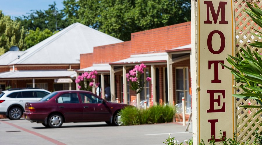 Onsite parking outside each room, with reception located at the rear of the premises.