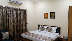 Lake Hills Serviced Apartment in Bhopal, image may contain: Bed, Furniture, Painting, Bedroom