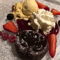 Lava cake with whipped cream and ice-cream