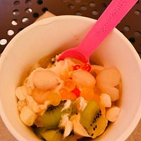 Kiwi, Mango, and Blueberry toppings on vanilla yogurt