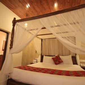 Our Traditional Standard rooms are decorated with antique furniture having striking floor.