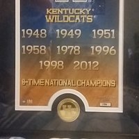 Plaque showing years men's basketball team won NCAA Championship