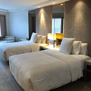 Midas Hotel and Casino in Luzon, image may contain: Bed, Furniture, Home Decor, Hotel