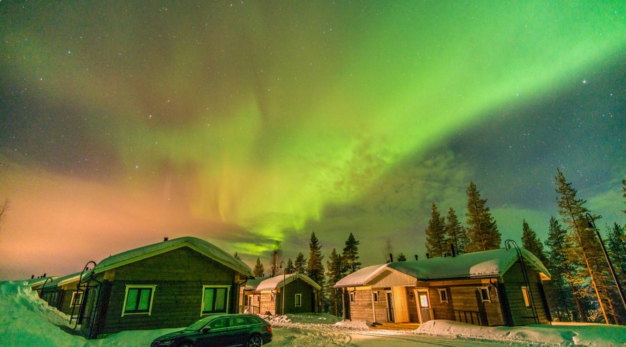 Aurora Borealis over cabins