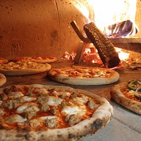Pizzas only take 5-7 mins to cook...depending how many pizzas are ahead of you, of course!