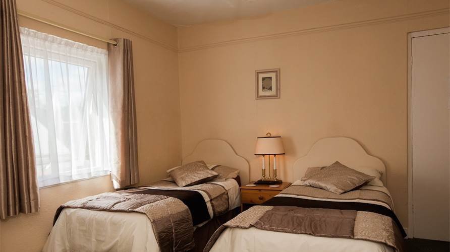 A twin bedded en-suite room.
