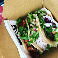 Three authentic Mexican tacos served in a box