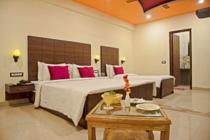 Spring Sky Mughalsarai By ShriGo Hotels in Mughal Sarai, image may contain: Interior Design, Home Decor, Resort, Hotel