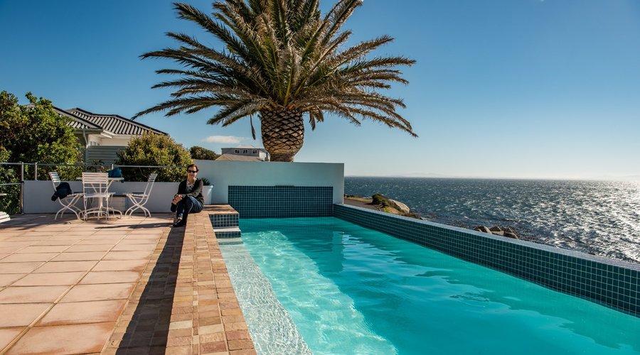 Pool area looking over False Bay (guest house in background)