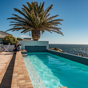 Pool area looking over False Bay (guest house in background)