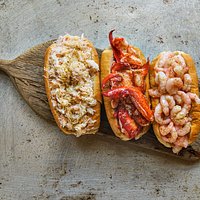 Each one of our rolls is packed with a quarter pound of fresh lobster, crab or shrimp!