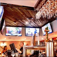 8 50" TV mounted in ceiling