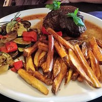 Steak with homemade fries and vegetables