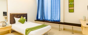 Treebo Trend Aamantran in Hyderabad, image may contain: Bed, Furniture, Bedroom, Room