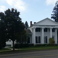 A view of the Library front from Route 20. Parking lot accessible from Mill St.