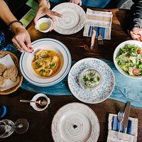 The Blue table - always full with delicious dishes and happy people