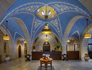 Jerusalem International YMCA, Three Arches Hotel in Jerusalem, image may contain: Altar, Chandelier, Arch, Crypt