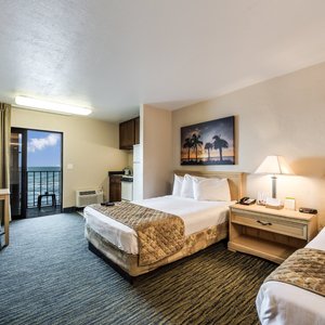 Beachside Hotel in Daytona Beach, image may contain: Monitor, Screen, Computer Hardware, Bed