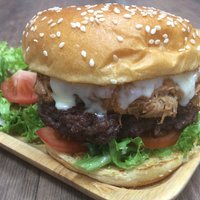 Simples special burger, 6oz Pattie topped with BBQ pulled pork and cheddar cheese.