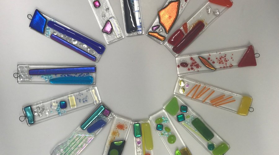 A rainbow of little hanging pieces made in a beginners workshop