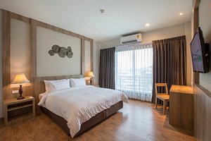 Civilize Hotel in Udon Thani, image may contain: Interior Design, Lamp, Furniture, Monitor
