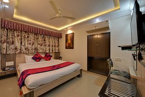 Hotel Lake Inn in Mount Abu, image may contain: Bed, Furniture, Chair, Bedroom