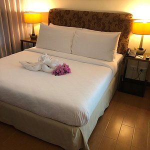 One Tagaytay Place Hotel Suites in Luzon, image may contain: Furniture, Bed, Lamp, Cushion