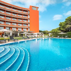 Aqua Pedra dos Bicos Design Beach Hotel in Albufeira, image may contain: Hotel, Resort, Chair, City