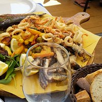 Fresh fritto misto with a glass of white wine