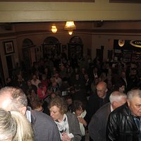 Quiet queues climbing the stairs from the foyer to the Victoria dress circle