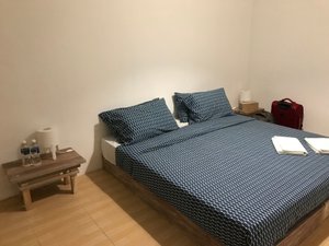 Ten RooMs in Bintan Island, image may contain: Furniture, Bed, Handbag, Bedroom