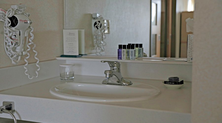 Sinks conveniently located outside of the bathroom