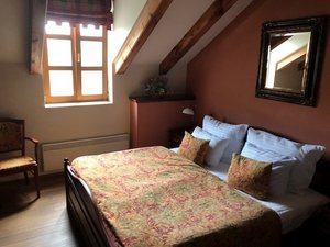 Romantic Hotel Mlyn Karlstejn in Karlstejn, image may contain: Loft, Indoors, Bed, Chair