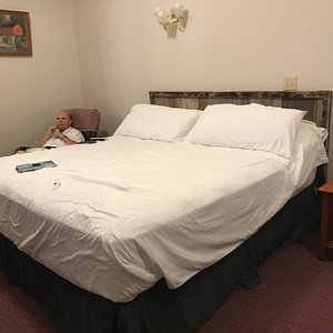 My husband relaxing in our very comfortable room.