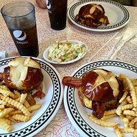 Bacon cheese burger on pretzel bread, coleslaw, crinkle fries