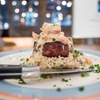 Hand cut USDA Certified Black Angus Filet, topped with fresh Lobster!